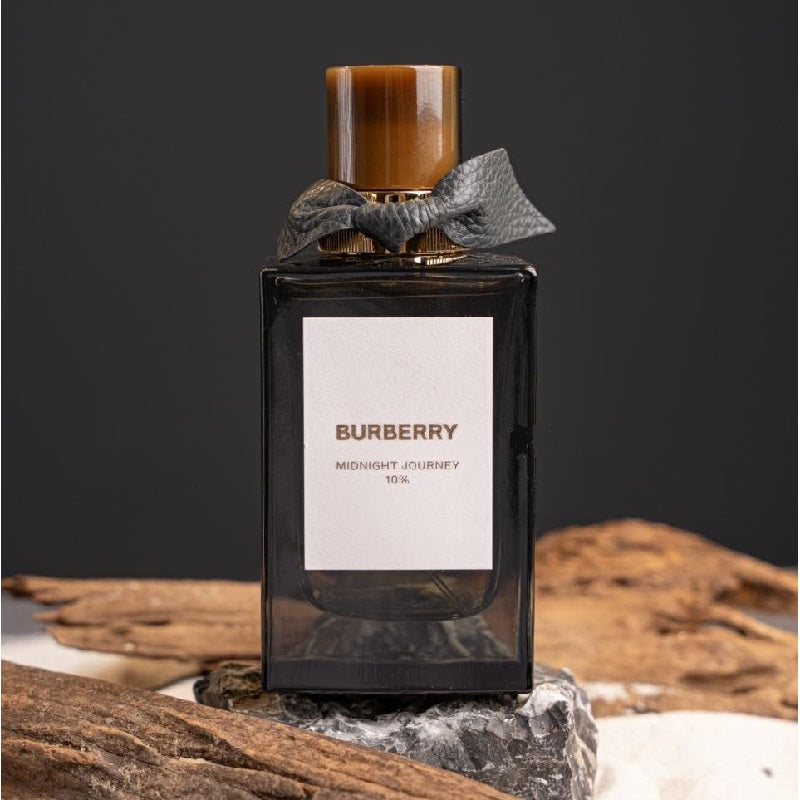 Perfume bottle with wooden cap and gray ribbon on dark background