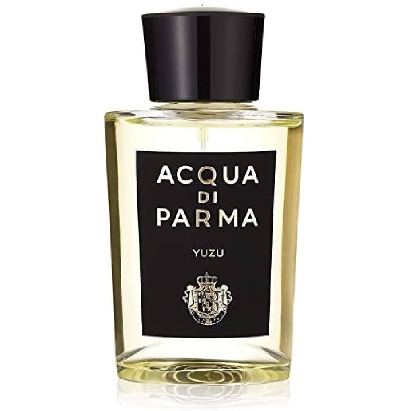 A clear glass bottle of Acqua Di Parma Yuzu Eau de Parfum with a black label and a gold and black cap.