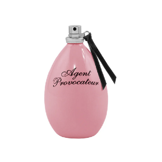 A pink bottle of Agent Provocateur Eau de Parfum with a black cap and ribbon, labeled with the brand name.