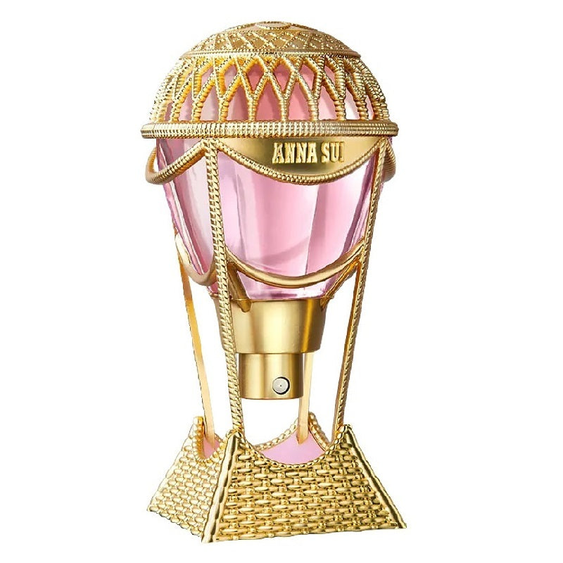 Pink perfume bottle with gold top and basket design on a white background