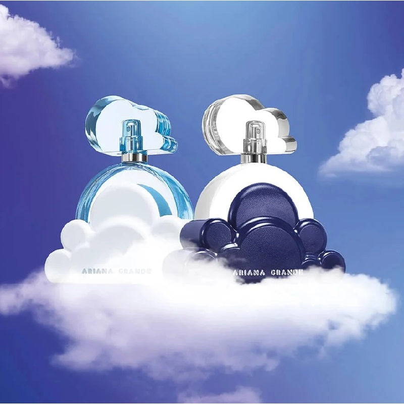 Two perfume bottles on a cloud with a blue sky background