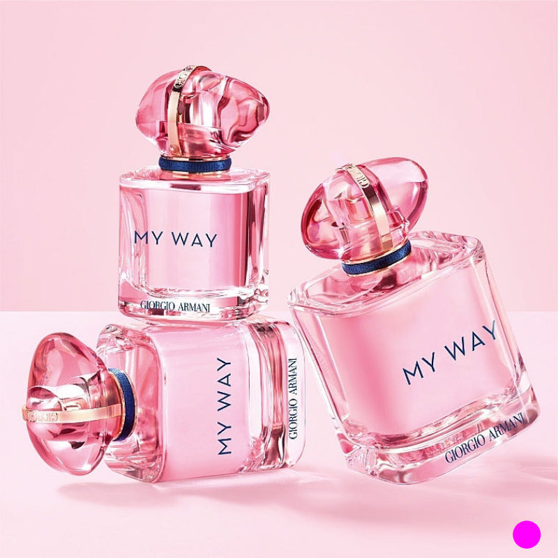 Giorgio Armani My Way Nectar perfume displayed in a feminine lifestyle scene with floral and pastel accents.