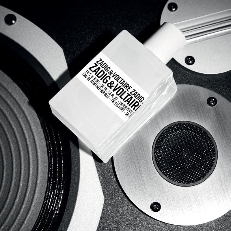 This is Her! 100 ml Eau de Parfum by Zadig & Voltaire – styled in a chic urban setting symbolising freedom, self-expression, and modern femininity.