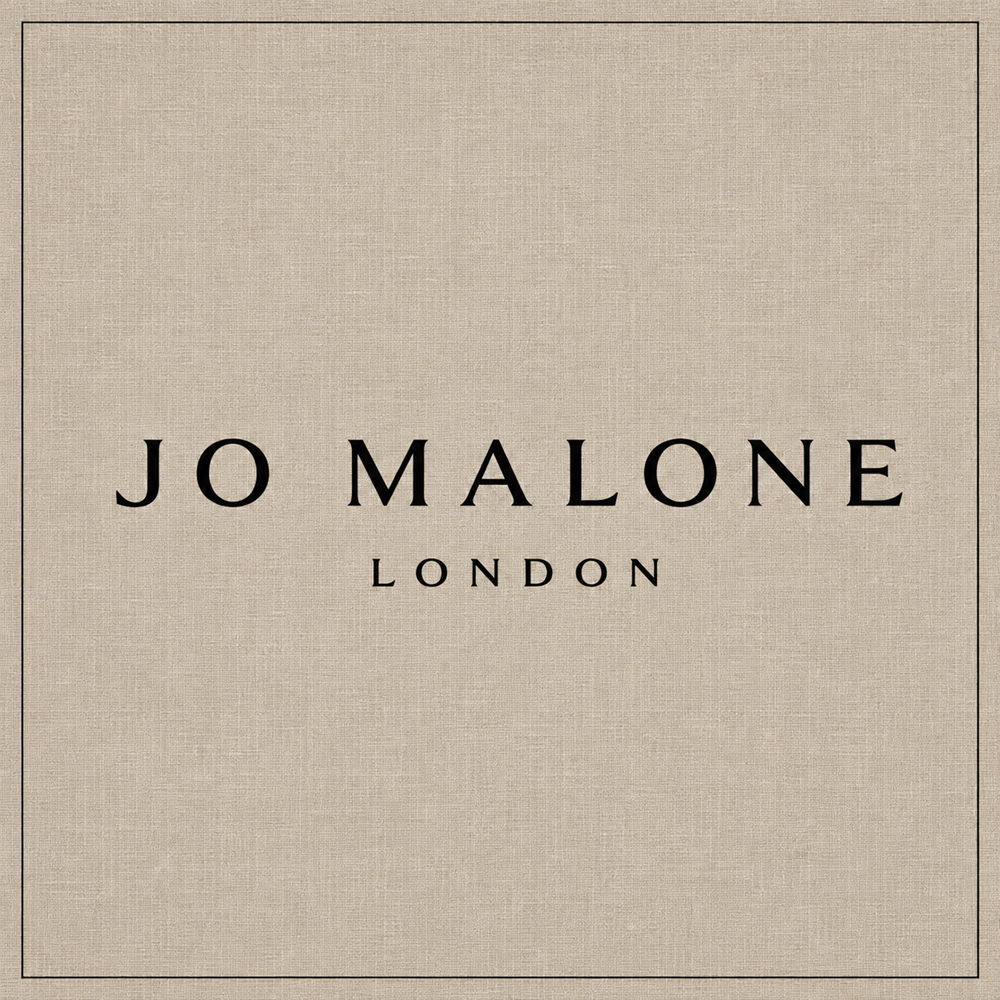 Jo Malone London logo on a warm neutral textured background
