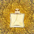 Perfume bottle with gold and white design on a decorative gold background
