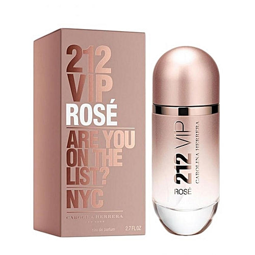 A product image featuring a bottle of 212 VIP Rose Eau de Parfum by Carolina Herrera next to its packaging box. The bottle is clear with a rose gold cap, and the box is pink with gold text.