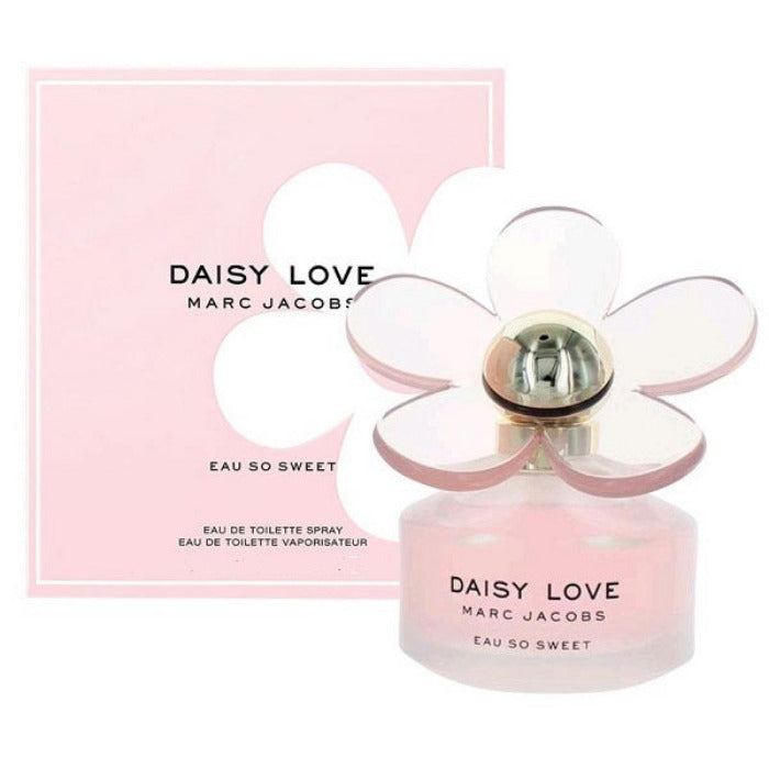 A bottle of Daisy Love Eau So Sweet perfume by Marc Jacobs with a pink label and a flower-shaped top, accompanied by its packaging.