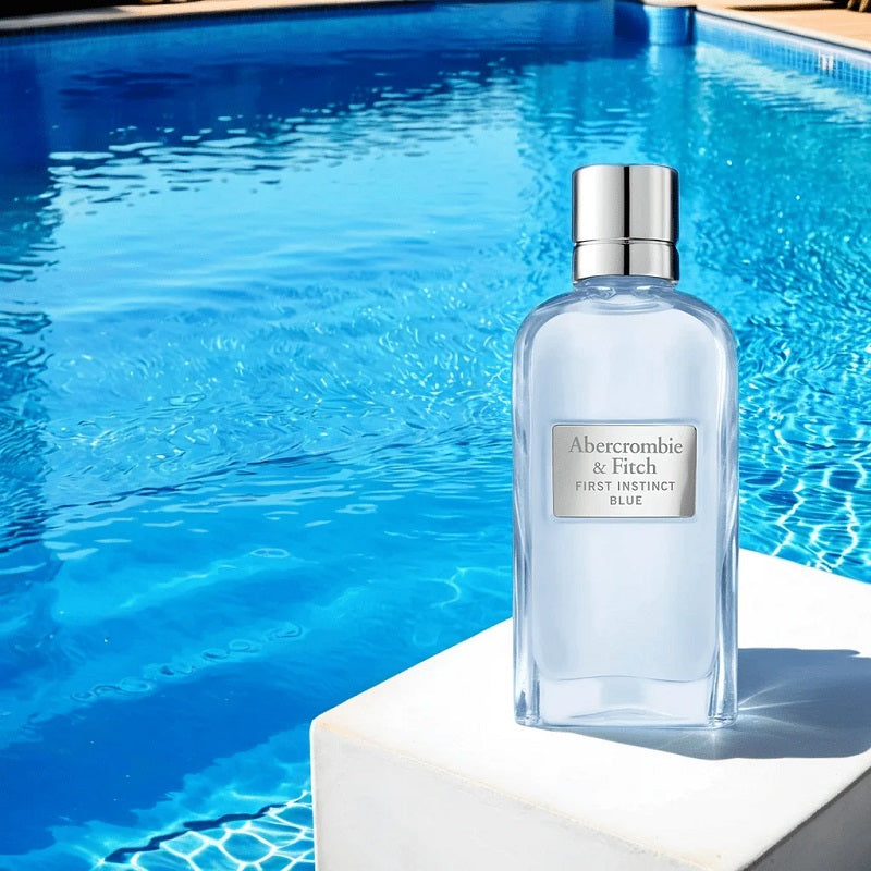 100ml Perfume bottle by Abercrombie & Fitch on a ledge with a pool in the background