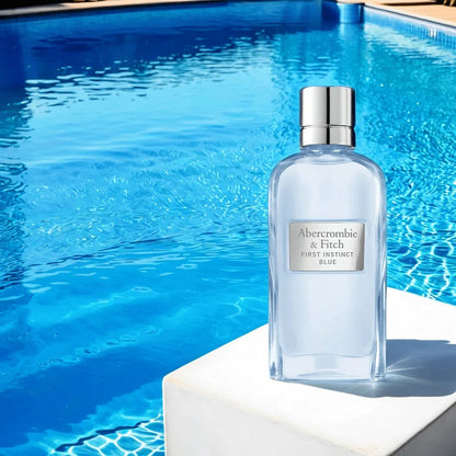 100ml Perfume bottle by Abercrombie & Fitch on a ledge with a pool in the background