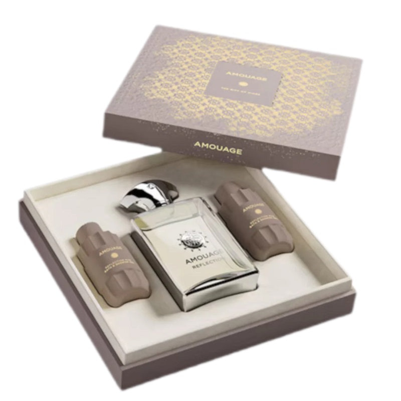 Amouage perfume set with bottles and packaging on a white background