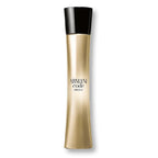 Gold and black Armani Code Absolu perfume bottle on a white background