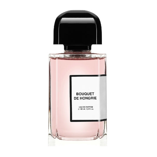 A 100ml bottle of Bouquet de Hongrie Eau de Parfum by BDK Parfums with a pink hue and a black cap.