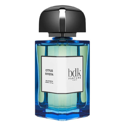 A blue glass bottle of 100ml Citrus Riviera Eau de Parfum by BDK Parfums with a black cap and a label that has the product name on it.