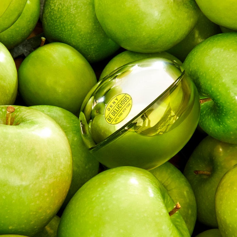 Silver bell with 'Danny Delicious' label surrounded by green apples