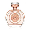 Guess perfume bottle with rose gold cap and clear base on a white background