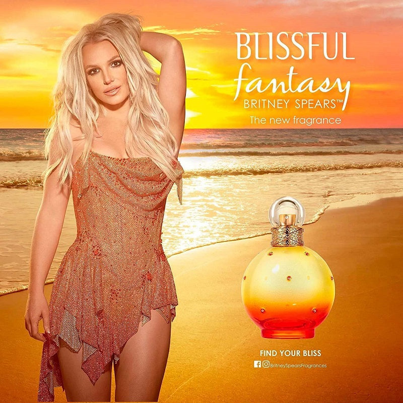 Advertisement for Britney Spears' 'Blissful Fantasy' fragrance with a woman on a beach.