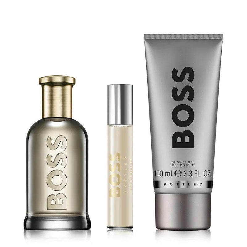 BOSS perfume set with a bottle, rollerball, and shower gel on a white background