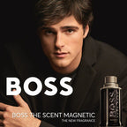 Advertisement for BOSS The Scent Magnetic fragrance with a man in a black suit.