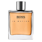 A bottle of Boss In Motion Eau de Toilette by Hugo Boss, with a clear, orange-colored liquid visible inside the transparent bottle and the brand and product name displayed on the label.