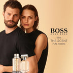 Lifestyle Image: Man wearing Hugo Boss The Scent Pure Accord in a bright, modern setting