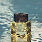 Bottega Veneta Illusione perfume bottle on a reflective water surface