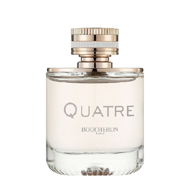 A glass bottle of Quatre Pour Femme Eau de Parfum by Boucheron with a white label and a gold and clear cap.