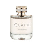 A glass bottle of Quatre Pour Femme Eau de Parfum by Boucheron with a white label and a gold and clear cap.