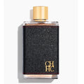 Perfume bottle with black textured design and gold cap on a white background