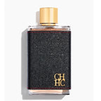 Perfume bottle with black textured design and gold cap on a white background