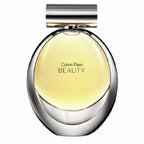 A bottle of Calvin Klein Beauty eau de parfum with a clear, golden liquid visible and the brand name displayed on the top.