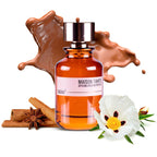 Perfume bottle with 'Maison Tahiti' label, surrounded by chocolate, cinnamon, and a flower on a white background