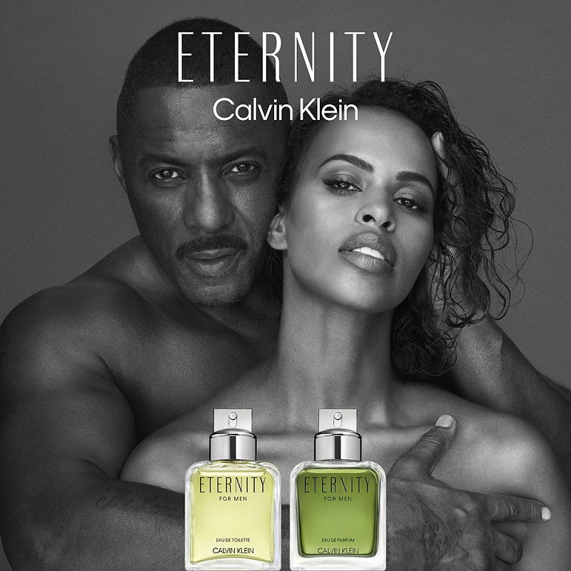 Calvin Klein Eternity perfume bottles held by a couple on a gray background
