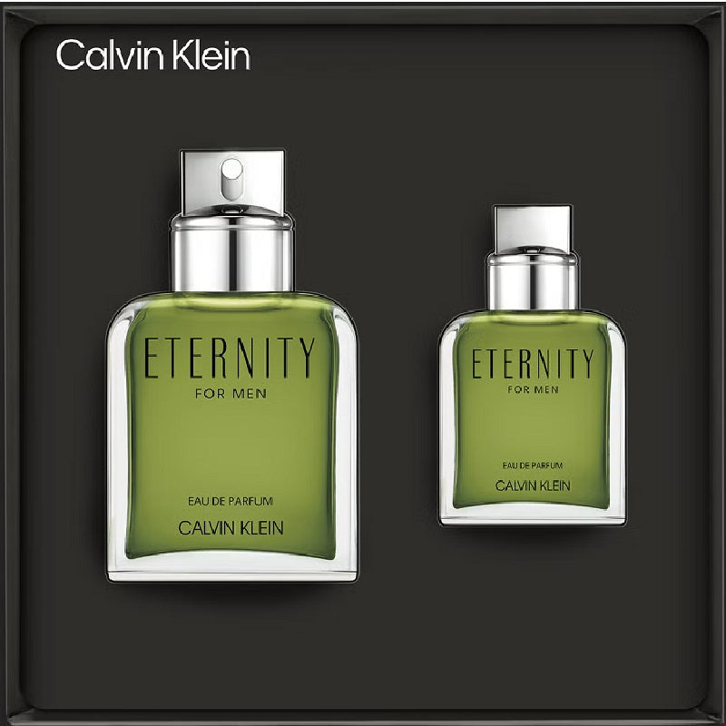 Two green Calvin Klein Eternity for Men perfume bottles on a black background