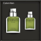 Two green Calvin Klein Eternity for Men perfume bottles on a black background