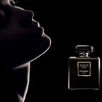 Chanel perfume bottle with a silhouette of a person against a black background