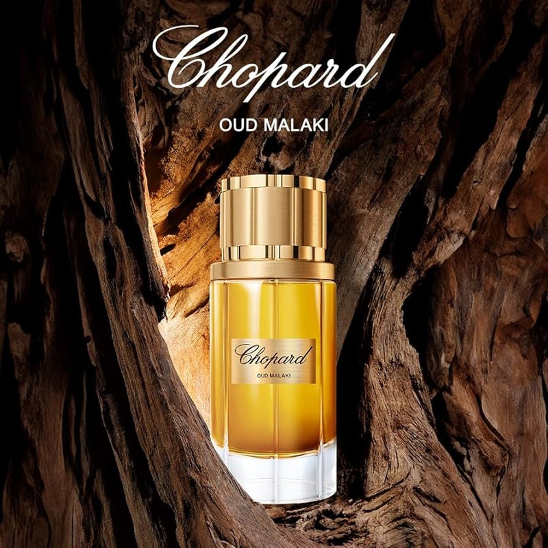 Chopard Oud Malaki perfume bottle on a wooden background