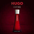 Red Hugo Boss perfume bottle on a dark red background