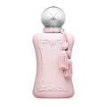 Pink perfume bottle with decorative elements on a white background