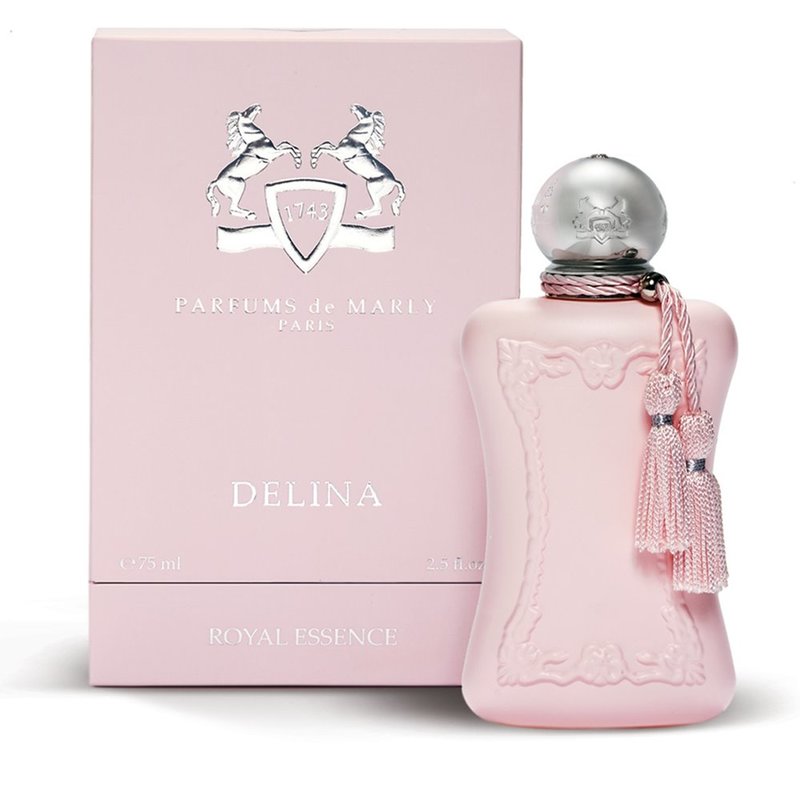 A pink bottle of Delina Eau De Parfum by Parfums De Marly, with a decorative box and a silver cap.