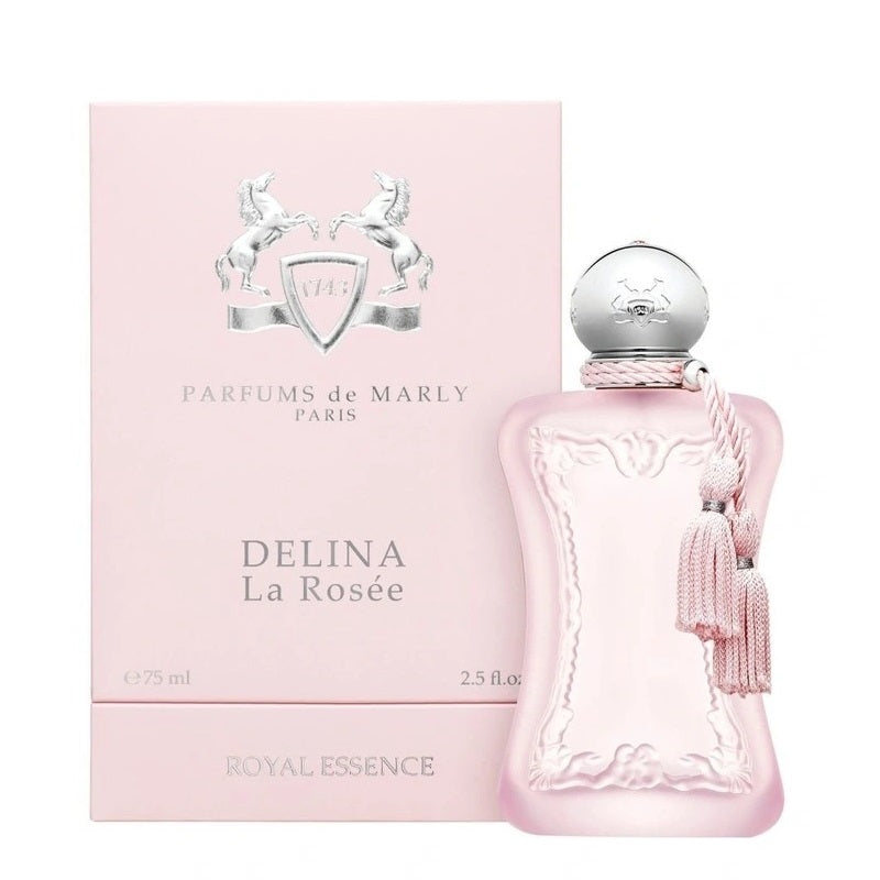 A product image featuring the Delina La Rosée 75ml Eau De Parfum by Parfums De Marly. The image shows the perfume bottle with a pink hue and a decorative cap, alongside its pink box with the brand and product name.
