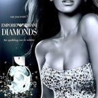 Advertisement for Emporio Armani Diamonds perfume featuring a woman and a diamond-shaped bottle.