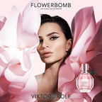 Advertisement for Viktor & Rolf Flowerbomb perfume with a woman and pink floral design.
