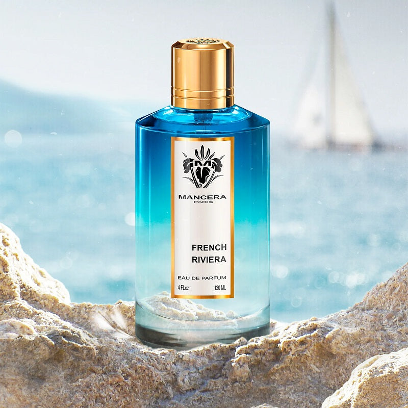 Mancera French Riviera perfume bottle on a beach with ocean view