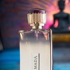 Perfume bottle with gold cap against a colorful blurred background