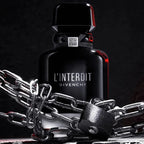 Givenchy L'Interdit perfume bottle with chains on a dark background