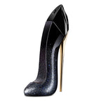 Black high-heeled shoe with glittery design on a white background