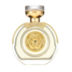 Guess perfume bottle with gold cap and decorative label on a white background