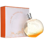 Perfume bottle and packaging on a plain background