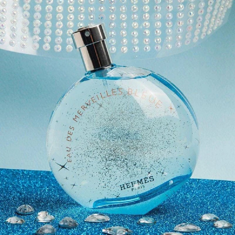 Blue perfume bottle with decorative background