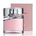 Pink perfume bottle with silver cap on a white background